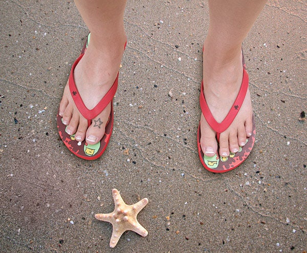 Thinkgeek Fresh Zombie Feet  Red Flip Flops on the Beach